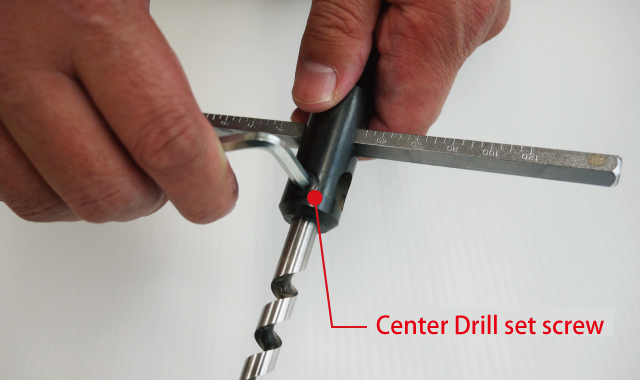 loosen the Center Drill set screw